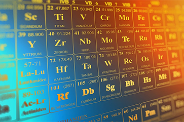 An illustration of a periodic table of elements treated with a blue and orange gradient.