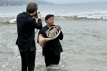 Aric Klein photographing Vincent Jurado in Malibu during the group's visit