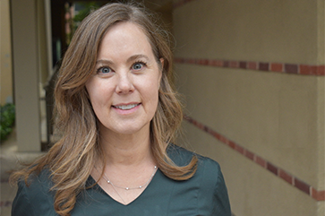 Head-and-shoulders photo of Heather Dallas in green top