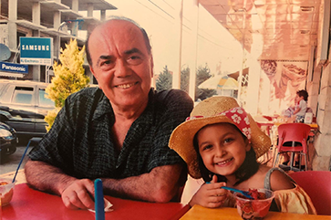 UCLA student Nour Rayess when she was little and her grandfather in Bhamdoun, Lebanon.