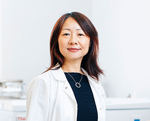 Yang-363-241 Dr. Lili Yang in a white lab coat.
