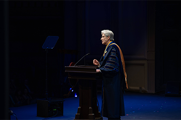 Julio Frenk speaking at a podium on the day of his inauguration.