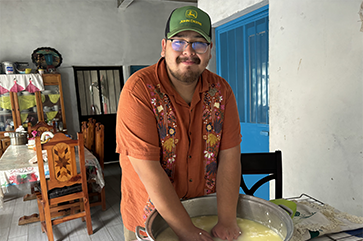 UCLA student Guillermo Miranda making cheese