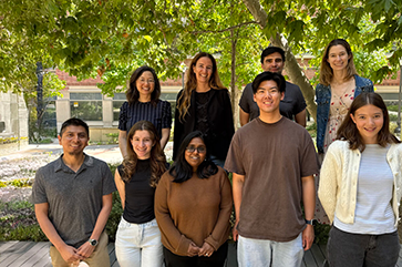 Researchers at UCLA, including Heather D. Maynard and Yi Tang, and UC Santa Barbara posing outdoors for a photograph.