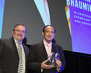 Mani+Bhaumik+Miguel+García+Garibay-363-241 Miguel García-Garibay, left, in black jacket and diamond-patterned tie, and Mani Bhaumik, in black jacket and pink tie, holding a UCLA College 100 trophy