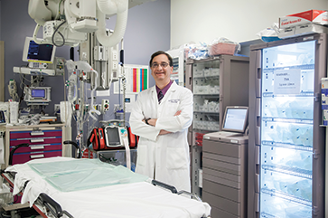 Jeffrey Saver in a white coat inside a lab.