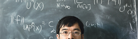 Mathematician Terence Tao stood in front of a blackboard in 2015.