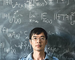 Mathematician Terence Tao stood in front of a blackboard in 2015.