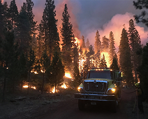 Wildfire+2017+Robert+Giovannetti+BLM-363-241 Yellow fire engine passes through the wildfire flames
