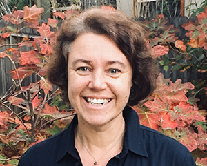 Portrait Barbara Fuchs with foliage in background