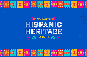 A vibrant graphic celebrating National Hispanic Heritage Month. The background is deep blue with subtle floral and leaf patterns. Brightly colored papel picado banners—orange, pink, blue, and yellow—line the top and bottom edges, each with intricate cut-out designs. Centered text reads “NATIONAL HISPANIC HERITAGE MONTH,” with “HISPANIC HERITAGE” in large, bold white decorative font, and “NATIONAL” and “MONTH” in smaller font flanked by floral icons.