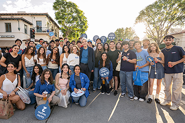 Chancellor Frenk and students in downtown Westwood Village.