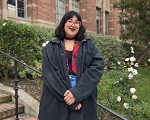 Nat Escobedo on the steps outside of Kaplan Hall