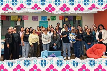 Group photo of Excelencia Scholars against a wall, framed with papel picado–inspired illustrated banners