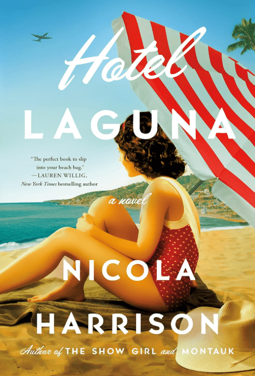 Book cover for Hotel Laguna by Nicola Harrison. It shows a woman in a red polka dot swimsuit sitting on a beach under a red-and-white striped umbrella, gazing at the ocean under a blue sky.