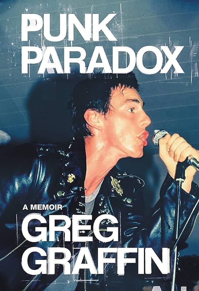 A person in a black leather jacket passionately sings into a microphone. The text reads: Punk Paradox: A Memoir, Greg Graffin. The background features horizontal lines that suggest a stage or venue setting.