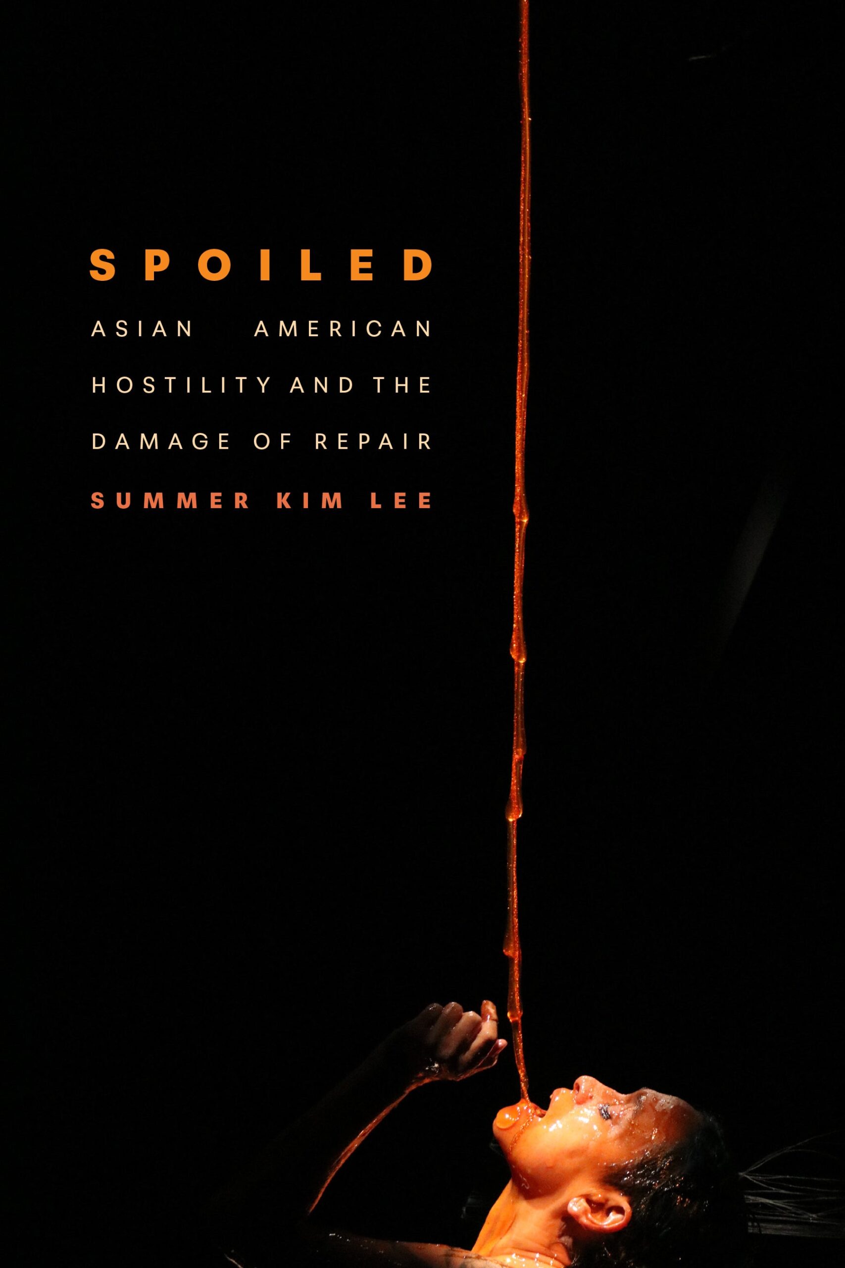 Book cover for Spoiled: Asian American Hostility and the Damage of Model Kinship by Summer Kim Lee, featuring a person tilting their head back and drinking from a long, thin stream of liquid against a dark background.